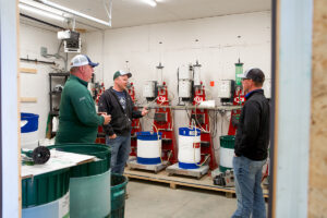 An ag banker meeting with two business owners. 