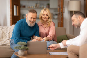 man pointing at laptop showing something to senior 2025 03 18 16 45 37 utc 1