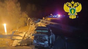 Seven killed after bridge collapse, train...